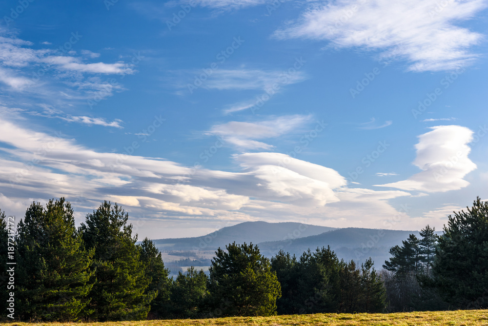 Beautiful landscape of mountains in autumn with a picturesque blue sky and clouds Beautiful landscape of mountains in autumn with a picturesque blue sky and clouds