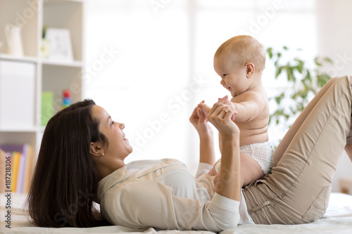 Mother and baby son playing...