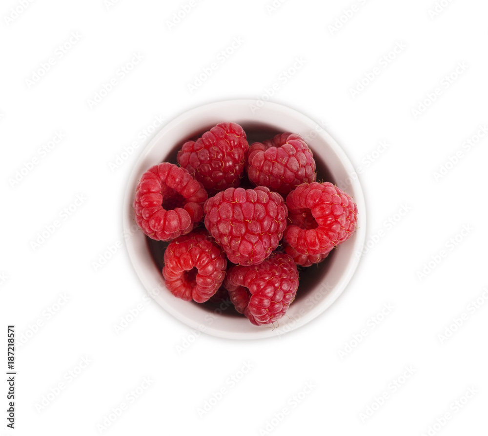 Raspberries in a wooden bowl isolated on white background. Vegetarian or healthy eating. Juicy and delicious raspberry with copy space for text. Top view. Raspberries in a wooden bowl isolated on white background. Vegetarian or healthy eating. Juicy and delicious raspberry with copy space for text. Top view.