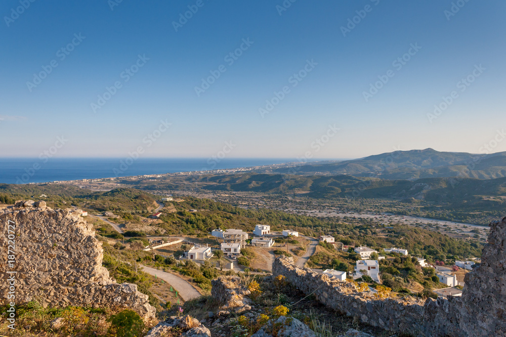 Small Greek Village, sea and mountains landscape from old castle ruins in Greece