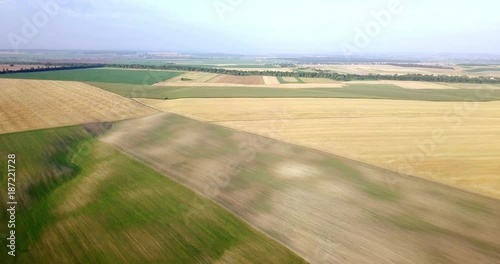 Aerial shot of fields with various types of agriculture. Farming. Aerial shot of farmland. Aerial shot of agricultural fields. View of agricultural Fields crops harvest. Rural Landscape. Counrtyside photo