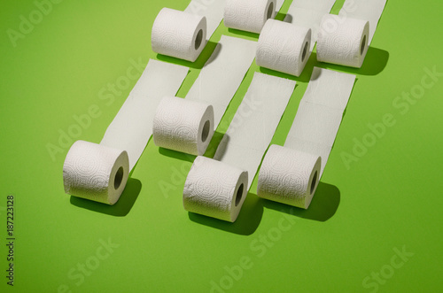 Toilet paper concept on green background. Hygiene and health. Concept photo.