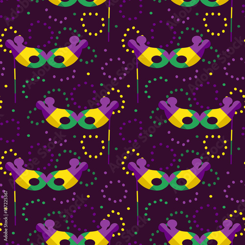Mardi Gras vector seamless pattern background with colorful harlequin masks and beads.