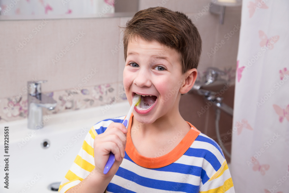 Little boy cleaning his teeth in the bathroom Little boy cleaning his teeth in the bathroom