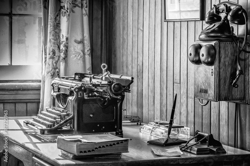 Vintage office with typewriter and telephone.
