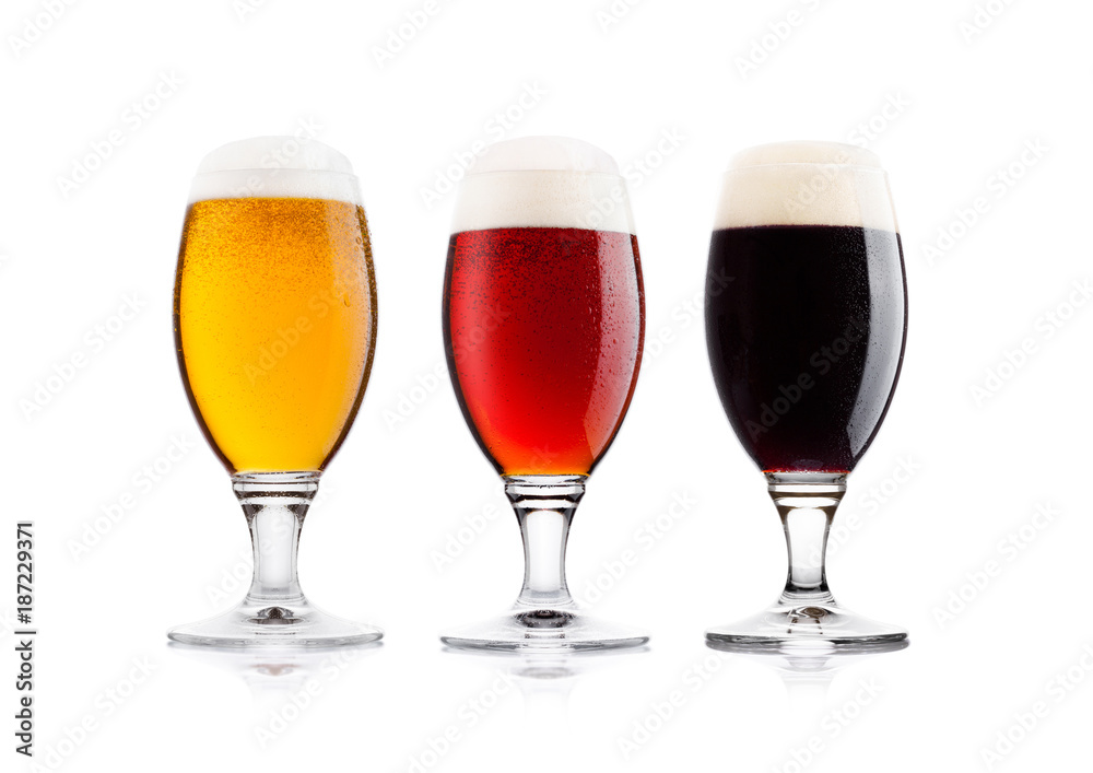 Cold glasses of lager stout and red beer with dew Cold glasses of lager stout and red beer with dew