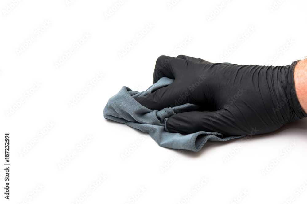 isolated hand with microfiber cloth and black disposable glove isolated hand with microfiber cloth and black disposable glove