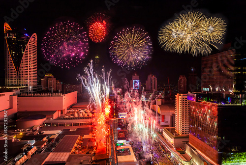 Colorful Firework New Years Celebration in Cityscape of Bangkok Thailand.