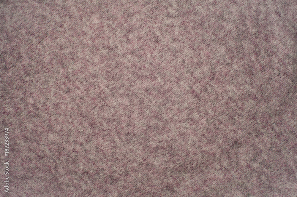 Fototapeta premium Texture of pink woven wool knitted sweater. Fabric background