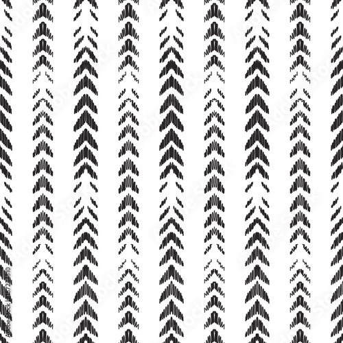 Ikat seamless pattern. Fashion wallpaper.