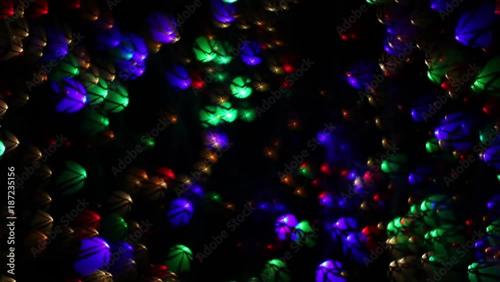 Abstract holiday background of fancy blinking lights with complex star pattern. Twinkling and weaving multicolor decoration. Celebration flashing colorful specks on dark night backdrop in full HD. Abstract holiday background of fancy blinking lights with complex star pattern. Twinkling and weaving multicolor decoration. Celebration flashing colorful specks on dark night backdrop in full HD.
