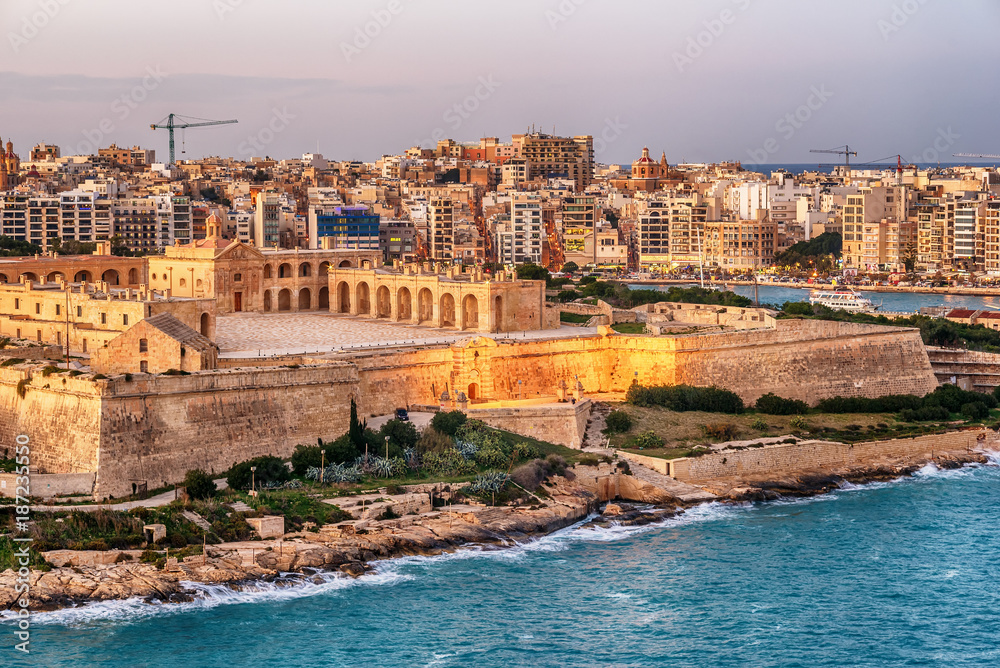 Malta: Manoel Island, Il-Gzira, Sliema and Marsans Harbour. Aerial view from city walls of Valletta at sunset
