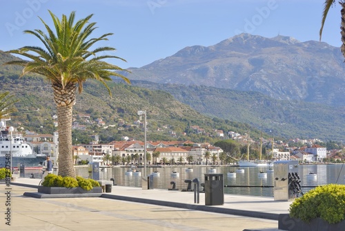Embankment of seaside Tivat town (Montenegro) with Lovcen mountain in the background. © mariel887