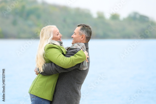 Happy mature couple hugging...