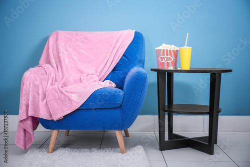 Comfortable armchair and ta...