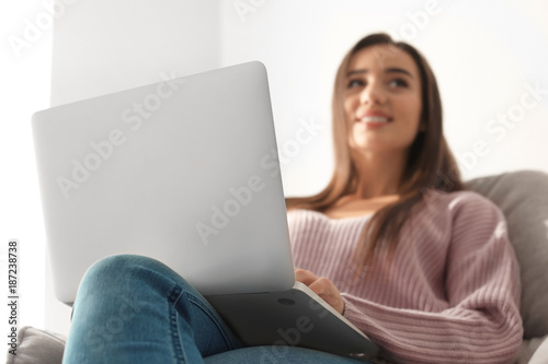 Young woman with modern lap...