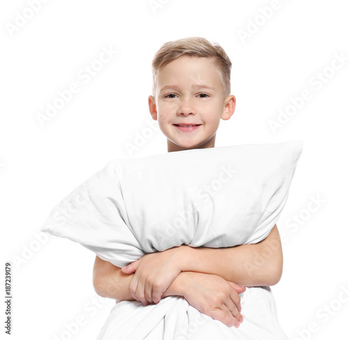 Cute boy with big pillow on white background