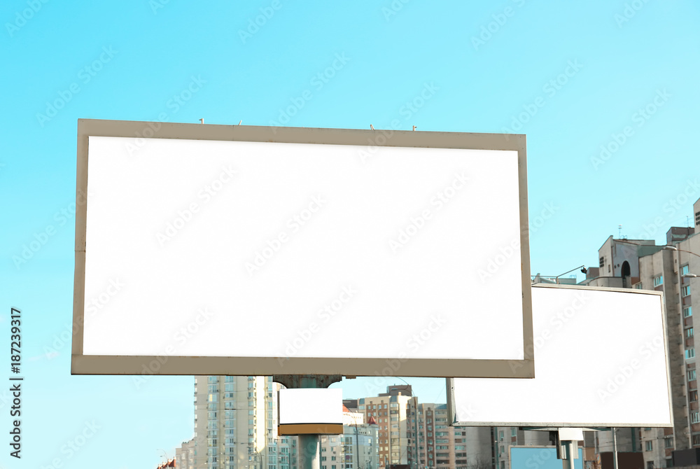 Blank advertising board on city street