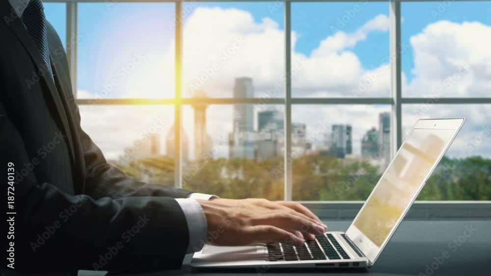 View of Dallas Texas.Close up hand Businessman using laptop View of Dallas Texas.Close up hand Businessman using laptop