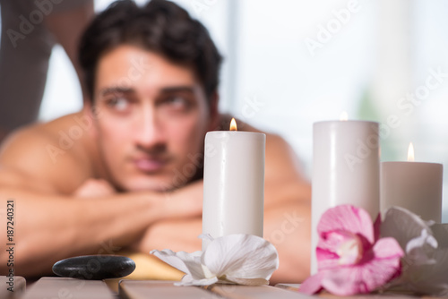 Young handsome man during spa procedure