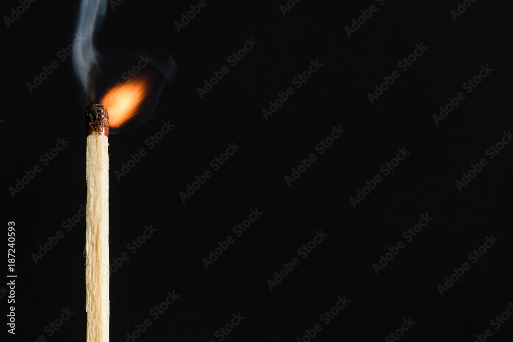 The time of the decay of the dying match flames on a black background closeup The time of the decay of the dying match flames on a black background closeup