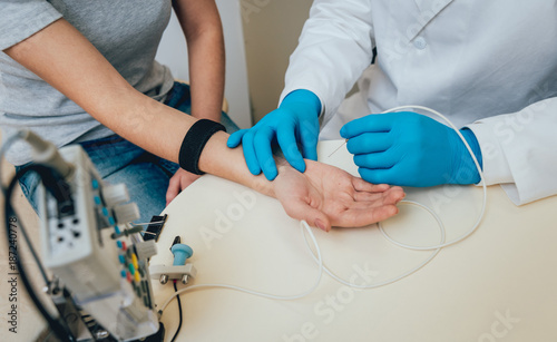 Patient nerves testing using electromyography. EMG