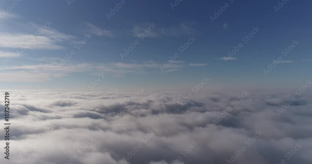 Beautiful cloudscape with large, building clouds and sunrise breaking through cloud mass. Beautiful cloudscape with large, building clouds and sunrise breaking through cloud mass.