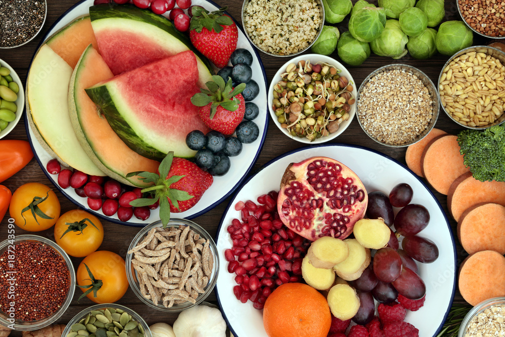 Health food concept with fresh fruit, vegetables, seeds, pulses, grains