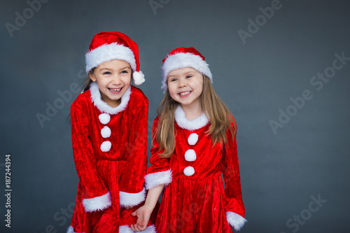 two girls Santa helpers having fun