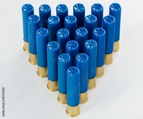 Pyramid of blue 410 gauge shotgun shells in a pattern photo