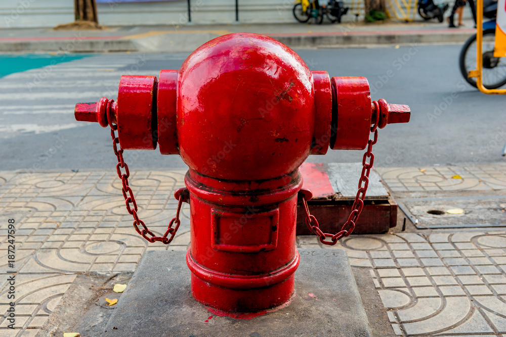 bright red fire hydrant in Bangkok street close-up bright red fire hydrant in Bangkok street close-up