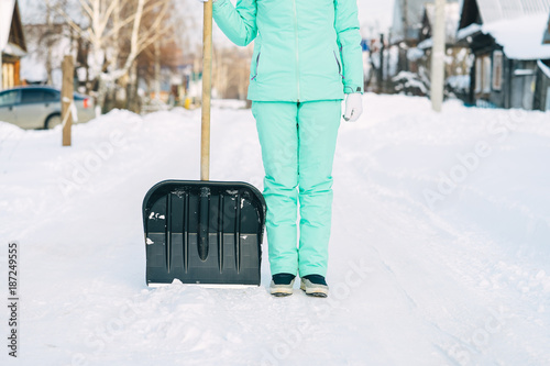 ready to remove snow with a shovel after the snowfall photo