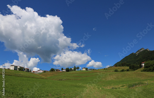 mountain with a gigantic cumulus cloud photographed with fisheye lens