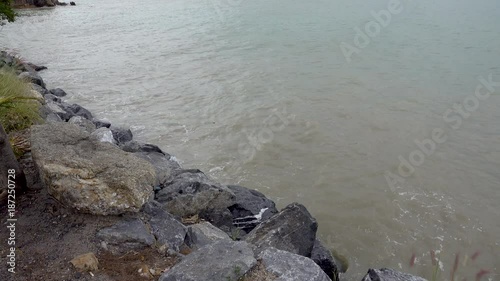 Waves beat on the stone quay, Koh Samui, Thailand