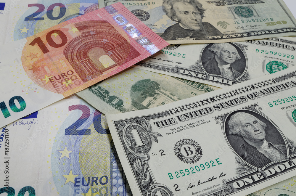 Obraz premium Euro banknotes and american dollars are laid out