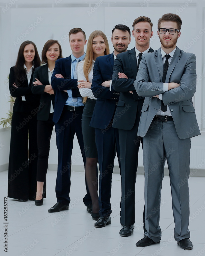 Business team in a line smiling at the camera