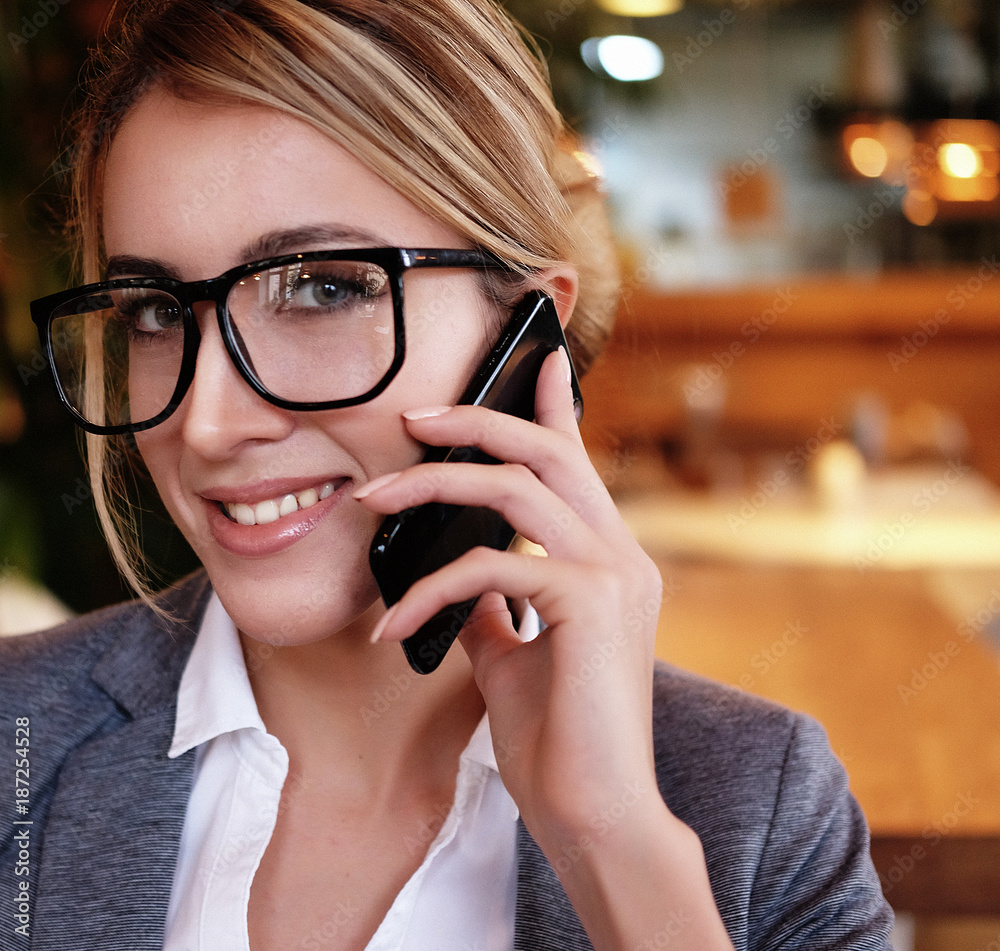 Business and people concept: Businesswoman with mobile phone