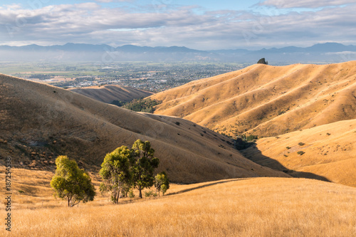 sunset over Wither Hills with Blenheim town in background, New Zealand