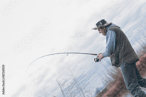 A man enjoys in the free time he spends himself on fishing