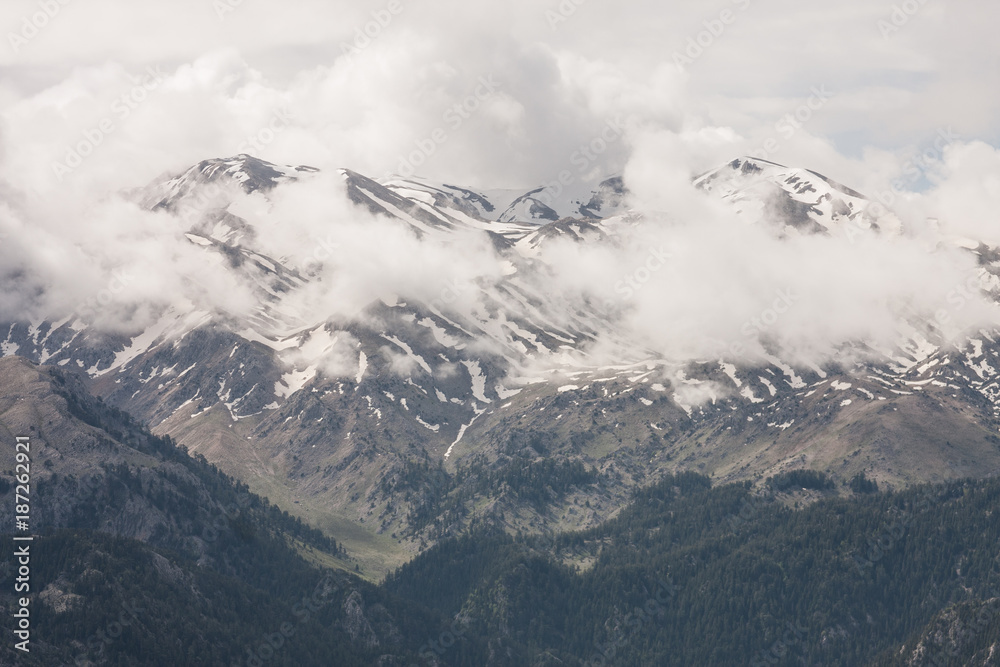 Snowcapped mountains with clouds