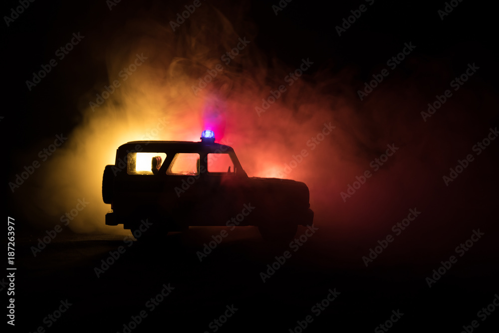 speed lighting of police car in the night on the road. Police cars on road moving with fog. speed lighting of police car in the night on the road. Police cars on road moving with fog.