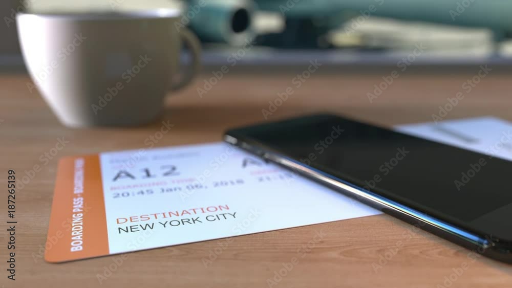 Boarding pass to New York City and smartphone on the table in airport. Travelling to the United States conceptual animation