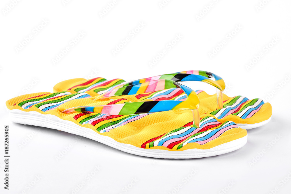 New fashion slippers for woman. Beautiful yellow flip flops for sea vacation. Summer holiday concept.