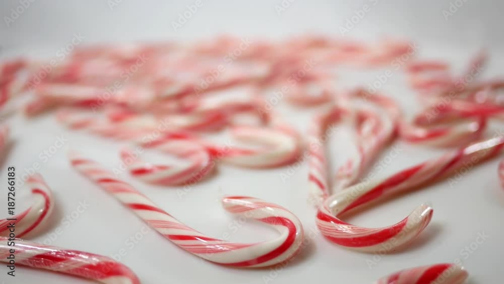 Red Vibrant Candy Canes Spinning over white
