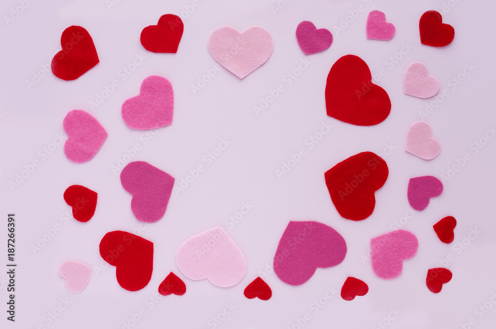 Card Valentine's Day. On a light pink background, red and pink hearts of different sizes with space for the inscription.