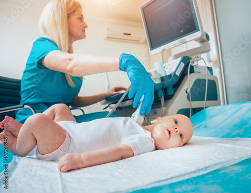 Doctor and little boy patient. Ultrasound equipment. Diagnostics. Sonography.