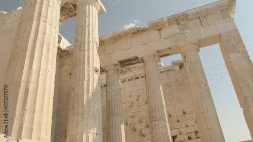tilt up shot of the columns of the erechthion at the acropolis in athens, greece photo