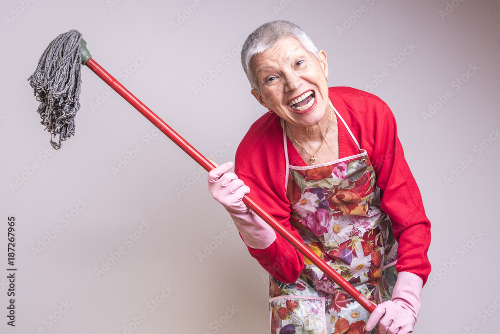 Cleaning senior lady crazy and frustrated, threatening to beat you with a  mop Stock Photo | Adobe Stock