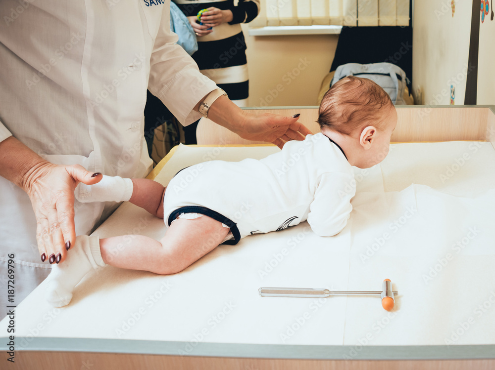 Neurologist diagnosing little boy. Pediatric