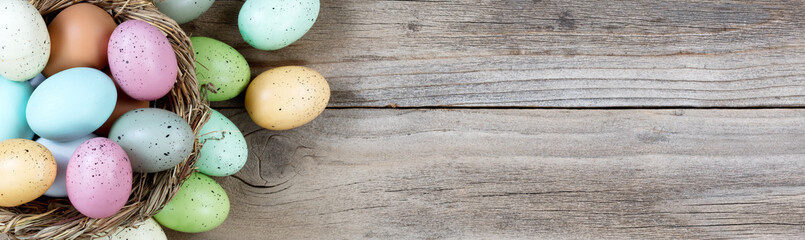Easter eggs on rustic wooden background for holiday concept 